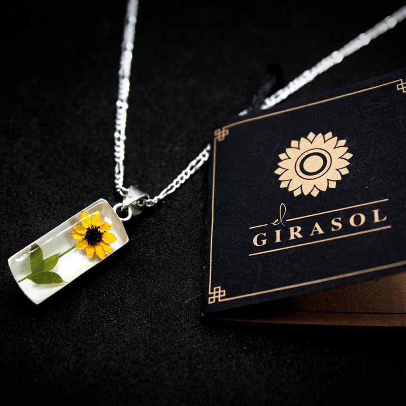 DIJE DE GIRASOL CILINDRO PLATA LEY 925 TAMI JOYERIA