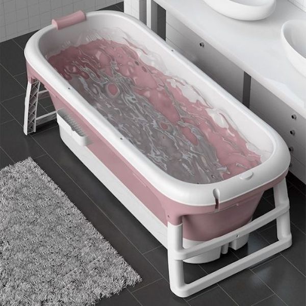 Tina adulto, plegable con termómetro, rodillo masageador y tapa color rosa.