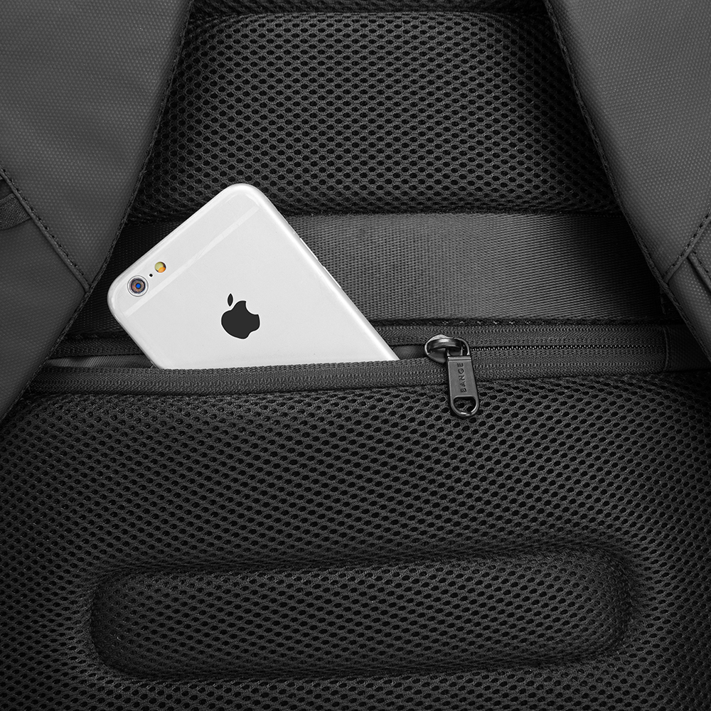  Mochila BANGE. Para laptop, iPad y artículos extra. Candado de seguridad antirrobo, puerto de carga USB y material repelente al agua. Modelo BG-7216