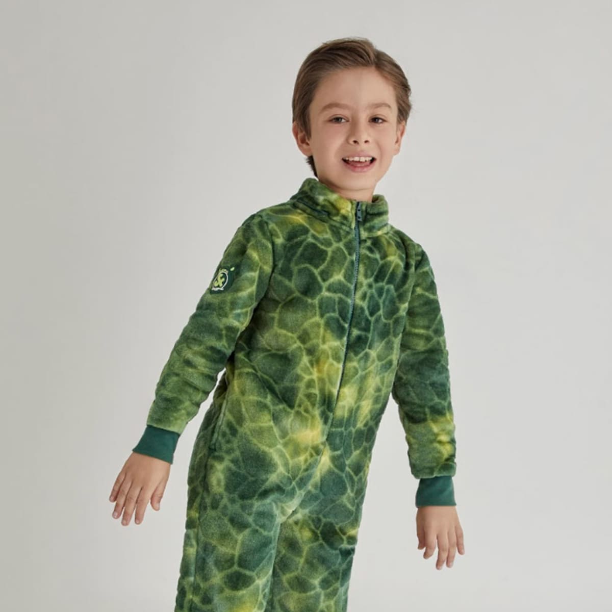 Mameluco 3D marca Next & Co. para niño de dinosaurio, color verde, con capucha desmontable. 