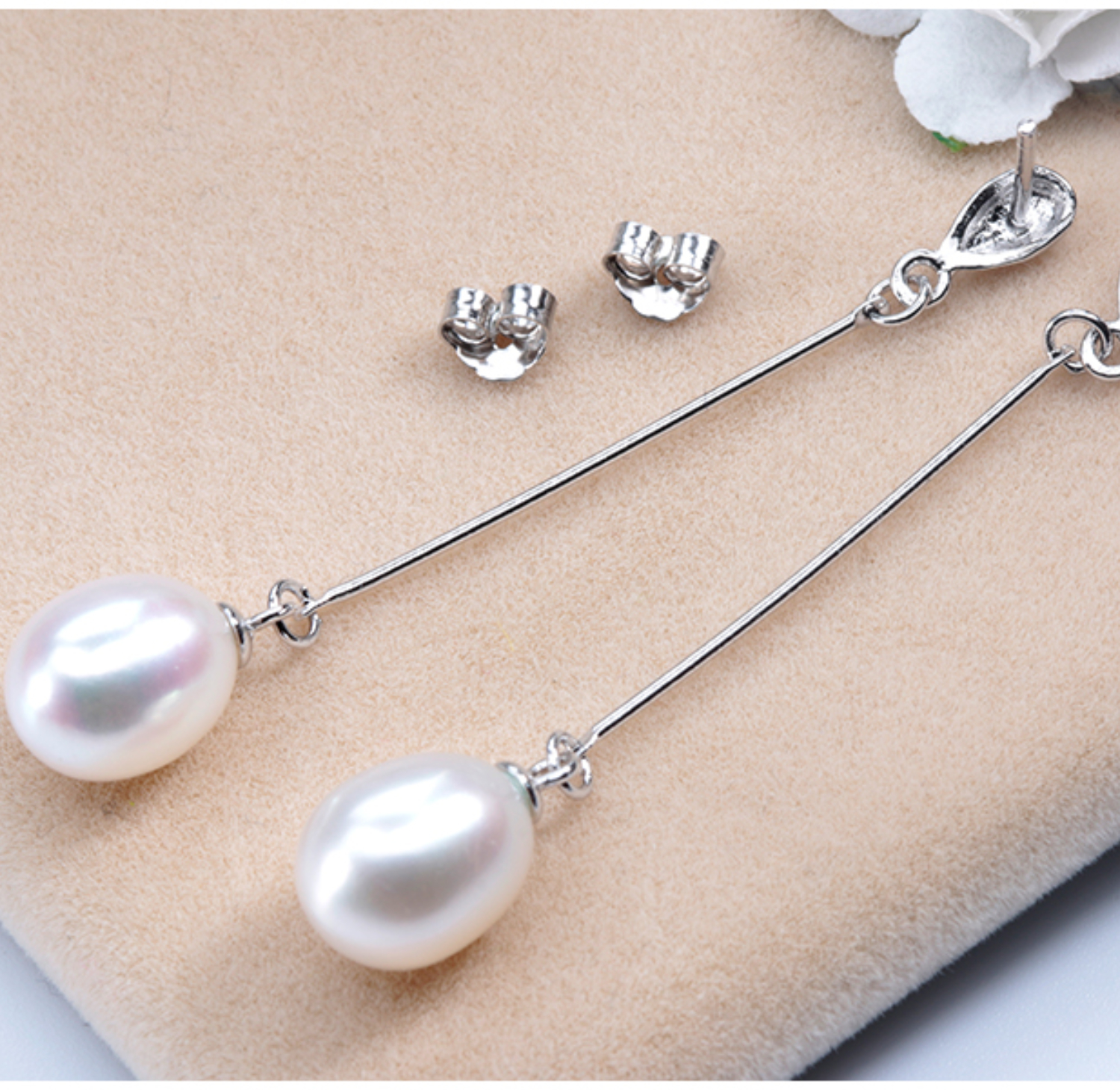 Pendientes largos de plata ley .925 y perlas ovaladas AAAA