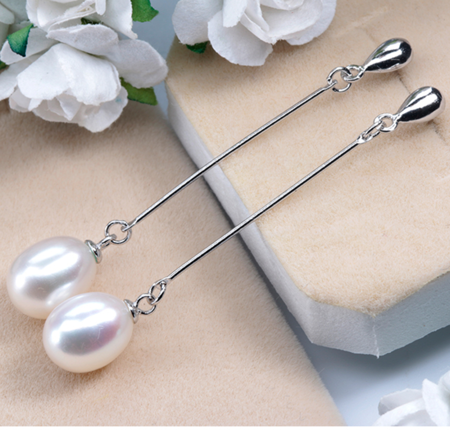 Pendientes largos de plata ley .925 y perlas ovaladas AAAA