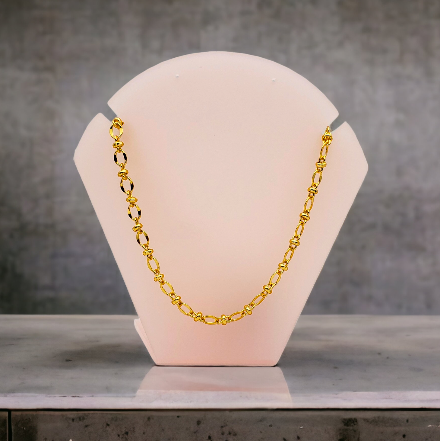 Cadena en chapa de oro eslabón oval separador dona