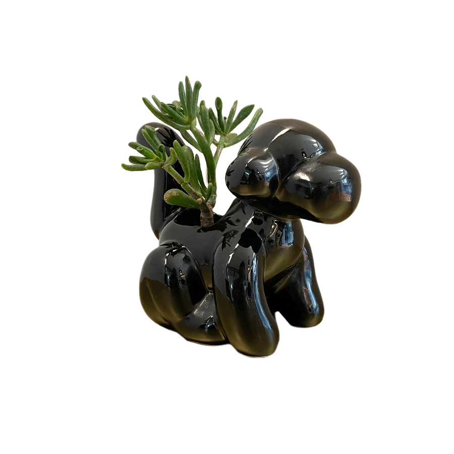 Maceta decorativa en forma de mono: elegancia y encanto en color negro brillante.