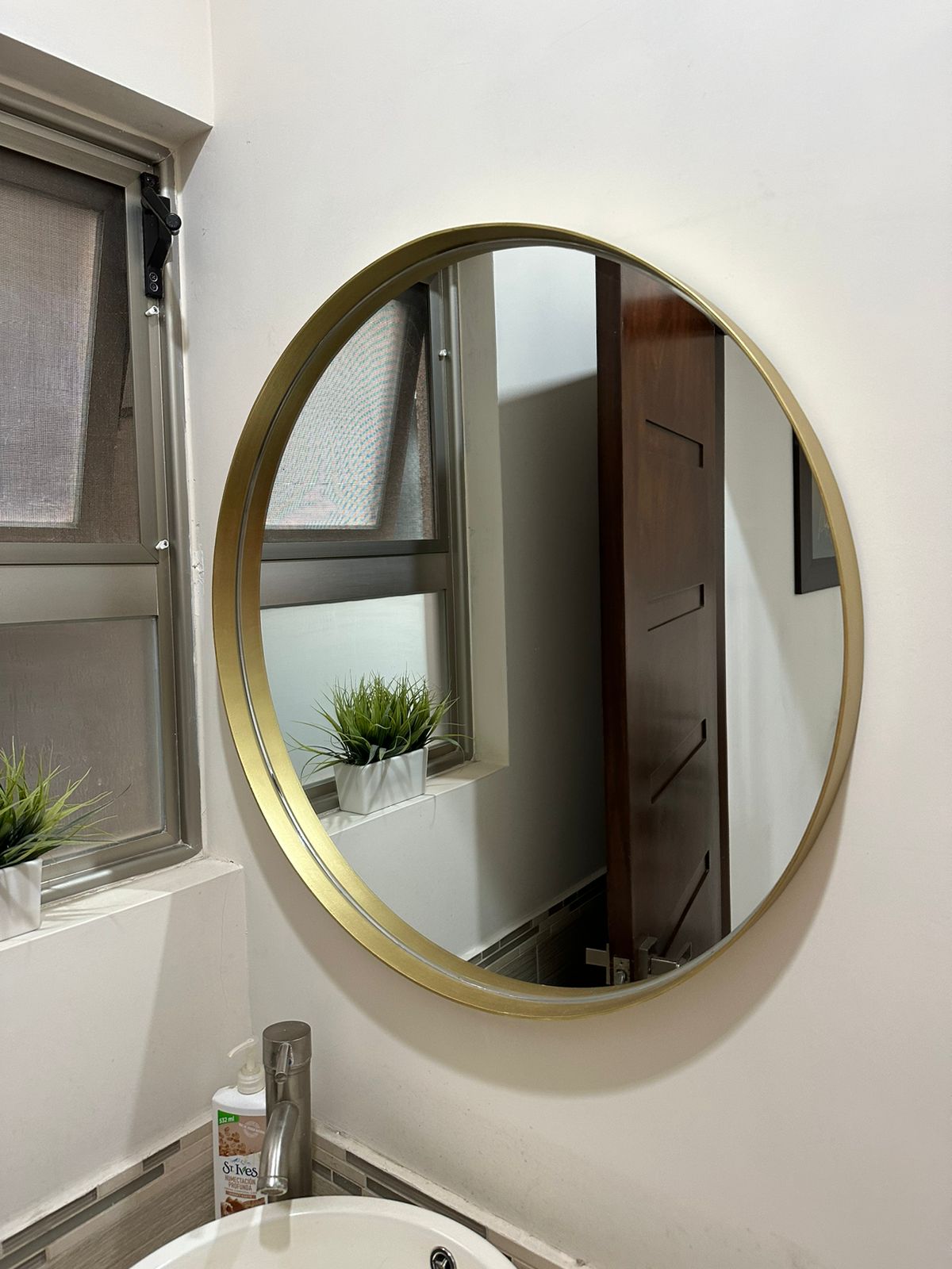 Espejo redondo con marco de metal de 80cm dorado