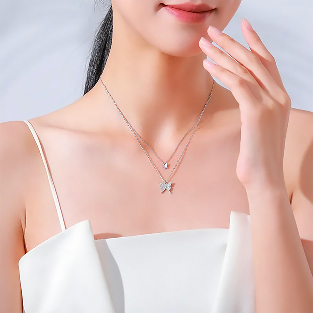 Collar doble con dijes de mariposa en Plata 925.