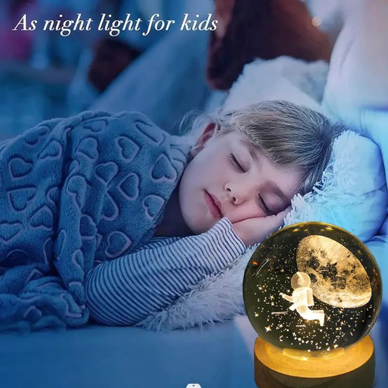 Lampara de mesa bola de cristal astronauta.