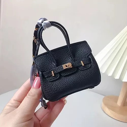 Funda  Negra Tipo Bolsa De Mujer Moda Protectora Compatible AirPods Generación 1 y 2.
