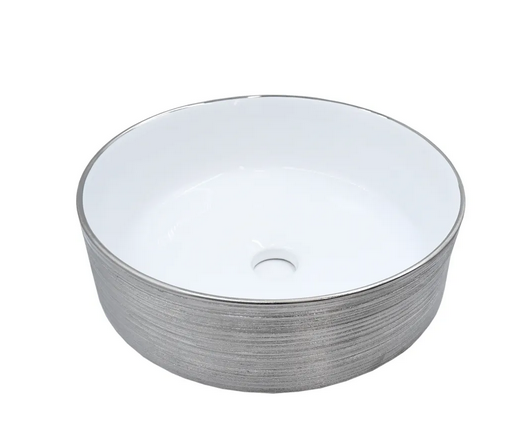 Lavabo Cerámico para Baño BAF, forma circular en color plata semi mate con detalles en relieve metalizados. De sobreponer, con diseño europeo ideal para todo tipo de baños. Dimensiones 36.0 x 36.0 x 12.5 cms. (base x altura x profundidad).