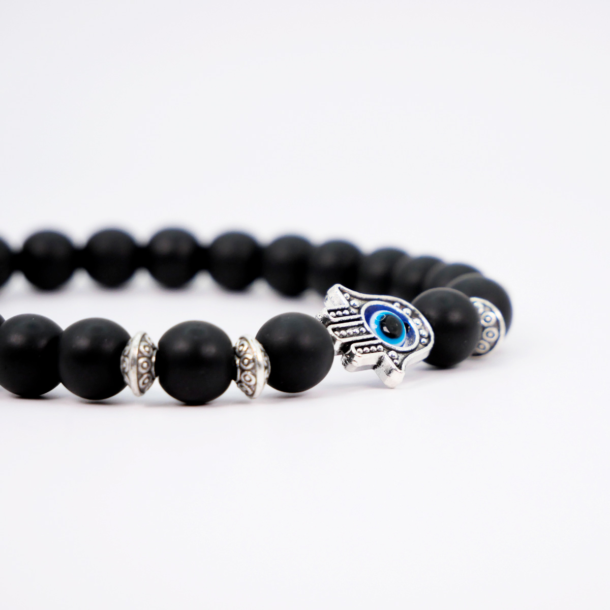 Pulsera ojo turco hombre Mano de Fátima con piedra onix mate.
